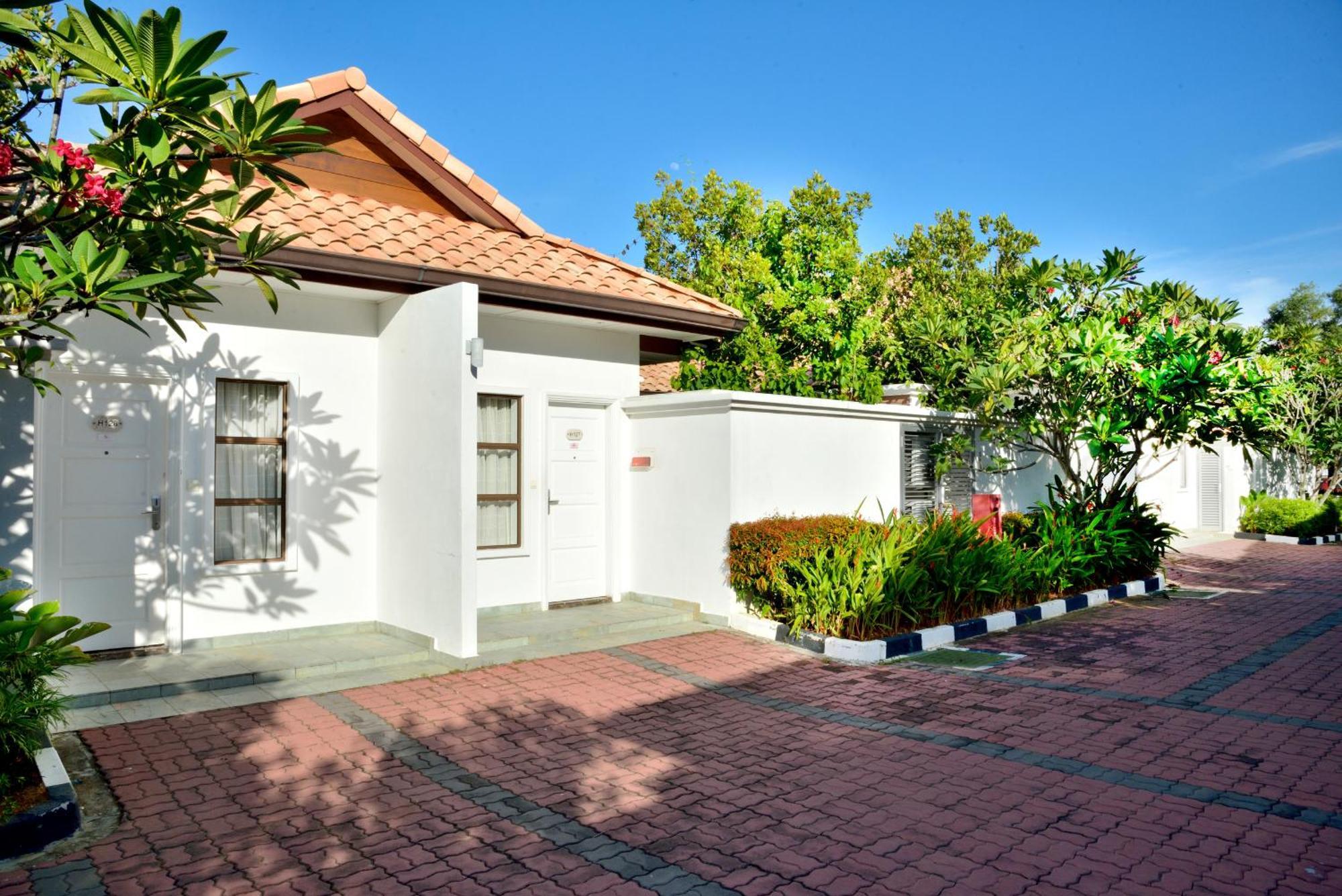 Grand Lexis Port Dickson Hotel Exterior photo A typical house in the village